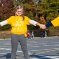 Girls holding hands in a circle at Girls on the Run