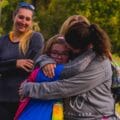 GOTR girl being hugged at the end-of-season 5K