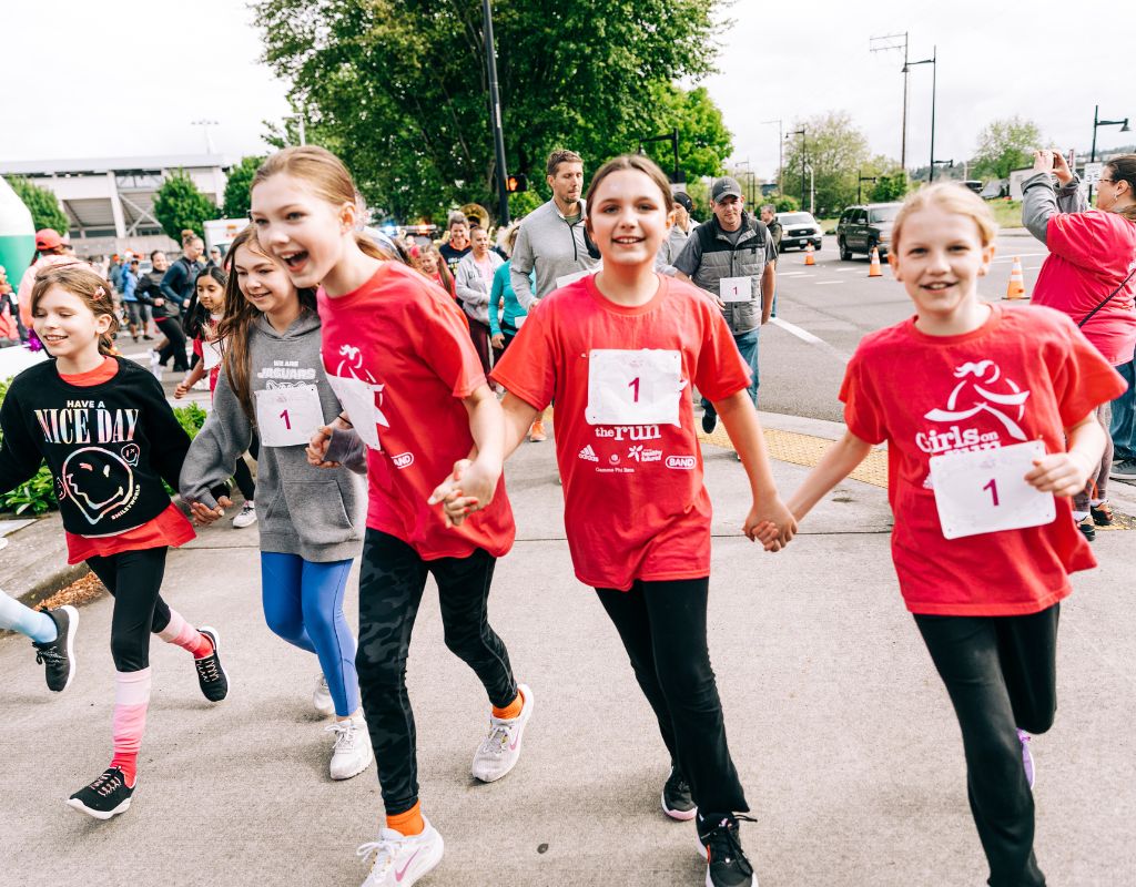 Runners holding hands