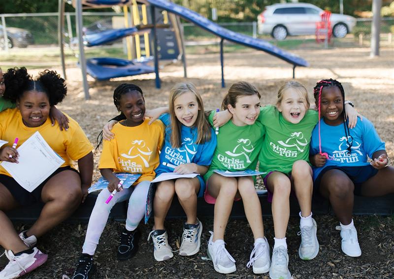 GOTR girls smiling and sitting together